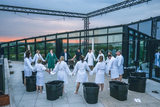 Several people in bathrobes at rooftop Hotel Ghent